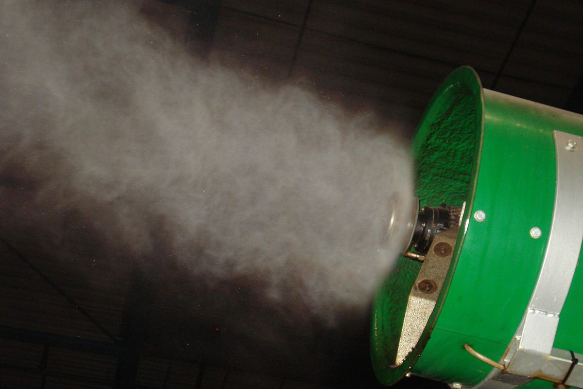 Close-up of a rotary atomiser unit projecting fine mist